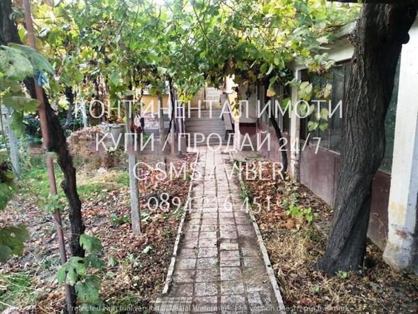 Код 62973. Едноетажна къща 70м2 с двор 320м2 с гараж. Къщата се състои от 2 спални, всекидневна, кор - снимка 7